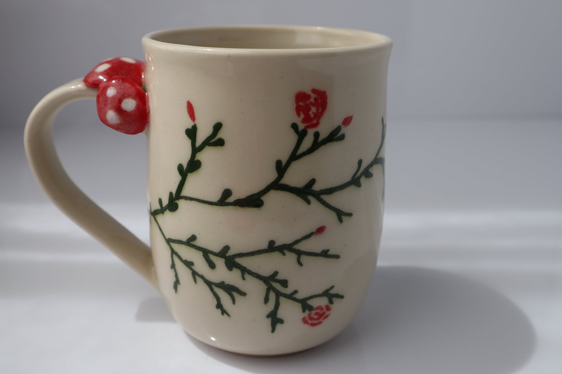 Ceramic mug with a fairy design on a white background